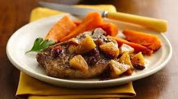 Pork chops, roasted carrots and potatoes